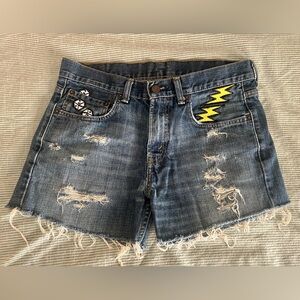 Vintage Levi's Blue Distressed Denim Shorts with patches